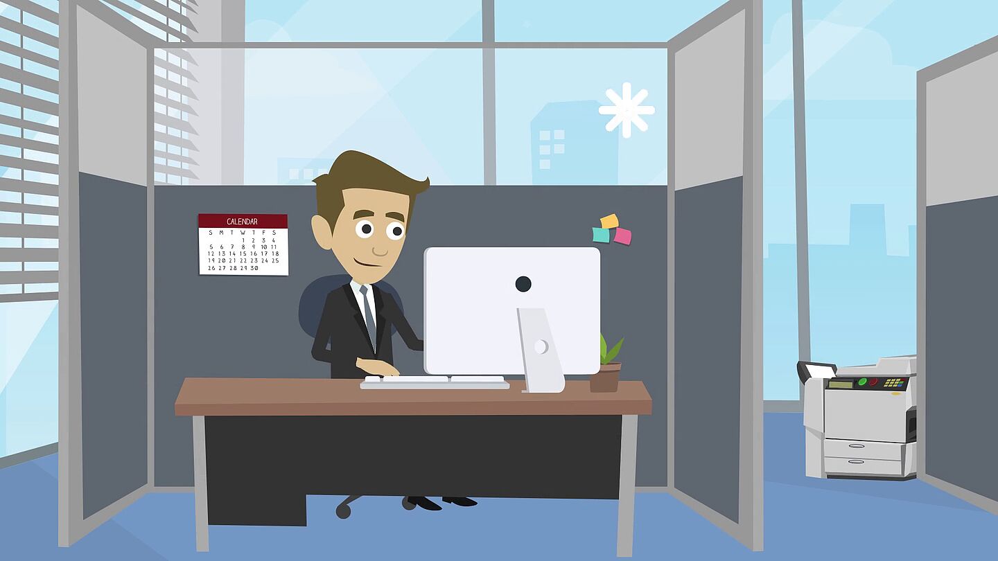 Ein Mann arbeitet an einem Schreibtisch in einem modernen Büro.